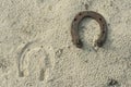 Rusty horseshoes on a sand background - rustic scene in a country style. Old iron Horseshoe - good luck symbol and mascot of well Royalty Free Stock Photo