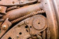 rusty industrial cogwheel and other scratched parts of old machine