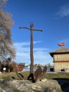 Rusty iron anchor as decoration on the coast of the lake