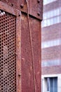 Rusty iron box in front of blurred building, abstract background image Royalty Free Stock Photo