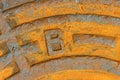 Rusty iron city sewer hatch. Royalty Free Stock Photo