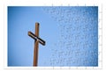 Rusty iron cross against a blue background - Rebuild our faith Royalty Free Stock Photo