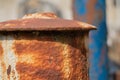 Rusty Iron Finials on Old Fence with Flaking Blue Paint