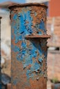 Rusty Iron Finials on Old Fence with Flaking Blue Paint