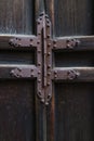 Rusty iron hinge on a old wooden door Royalty Free Stock Photo