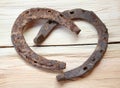 Rusty old iron horseshoes as a love heart sign Royalty Free Stock Photo