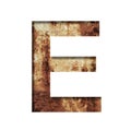 Rusty iron letters. The letter E cut out of paper on the background of an old rusty iron sheet with rust stains and cracks.