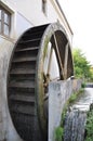 Rusty iron wheel of old mill water.Water Wheel - motion blur on wheel.