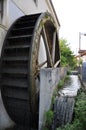 Rusty iron wheel of old mill water.Water Wheel - motion blur on wheel.