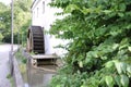 Rusty iron wheel of old mill water.Water Wheel - motion blur on wheel.