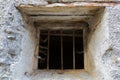 Rusty iron window bar with spider web cobwebs and bird feather a Royalty Free Stock Photo