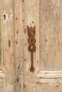 Rusty keyhole on an old weathered wooden door Royalty Free Stock Photo