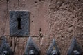 Rusty keyhole in old wooden door Royalty Free Stock Photo