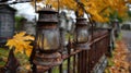 Rusty Lanterns on a Cemetery Fence in Autumn Royalty Free Stock Photo