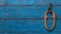 Rusty latch on a blue wooden background isolated and detailed Royalty Free Stock Photo