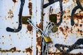 Rusty lock on the gate of a small gray container close-up Royalty Free Stock Photo