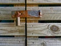 Rusty lock, hasp and staple on a barn door