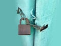 Rusty lock with locked blue metal door texture background with space Royalty Free Stock Photo