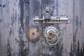 Rusty lock locked the old wooden door