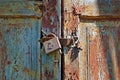 Rusty lock on old wooden gate Royalty Free Stock Photo