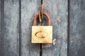 The Rusty lock with wood door, Old lock close home door Royalty Free Stock Photo