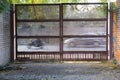 A rusty locked metal gate