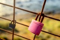 Rusty love locks hanging on the fence as a symbol of loyalty and