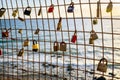 Rusty love locks hanging on the fence as a symbol of loyalty and