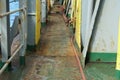 Rusty main deck without maintenance of the container vessel on the starboard side. Royalty Free Stock Photo