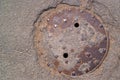 Rusty Manhole set in road man hole