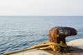 Rusty marine dock bollard