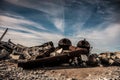 Rusty materials in a deserted area under the blue sky