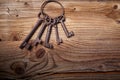 Rusty medieval keys on wood table Royalty Free Stock Photo