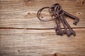 Rusty medieval keys on wood table Royalty Free Stock Photo