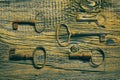 Rusty medieval keys on worn out wood table