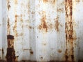 Rusty metal background with old layers of white paint. Texture rusted shipping container.