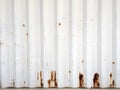 Rusty metal background with old layers of white paint. Texture rusted shipping container. Royalty Free Stock Photo