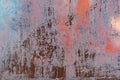 Rusty metal background with old red peeling cracked paint, atmospheric impact, outdoors, horizontal photo. Royalty Free Stock Photo