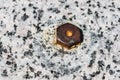 Rusty metal bolt in granite 2