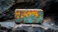 Rusty Metal Box on Dark Rocks Royalty Free Stock Photo