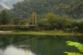 Rusty metal bridge over river in mountains Royalty Free Stock Photo