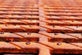 Rusty metal drain grate during the day Royalty Free Stock Photo