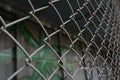 Rusty metal mesh close-up on the background of painted walls Royalty Free Stock Photo