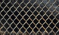 Rusty metal mesh fence, diamond pattern, weathered texture, industrial background Royalty Free Stock Photo