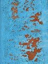 Rusty metal panel with cracked blue paint, corroded grunge metal background Royalty Free Stock Photo