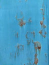 Rusty metal panel with cracked blue paint, corroded grunge metal background Royalty Free Stock Photo