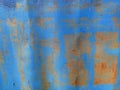 Rusty metal panel with cracked blue paint, corroded grunge metal background Royalty Free Stock Photo