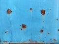 Rusty metal panel with cracked blue paint, corroded grunge metal background Royalty Free Stock Photo