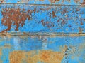 Rusty metal panel with cracked blue paint, corroded grunge metal background Royalty Free Stock Photo