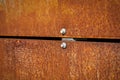 Rusty metal panels bolted with screws, texture and background Royalty Free Stock Photo